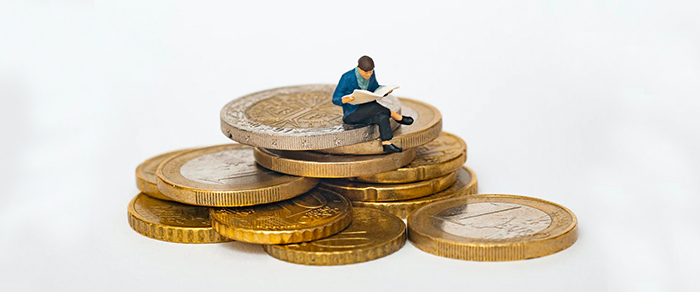 Man sitting on coins